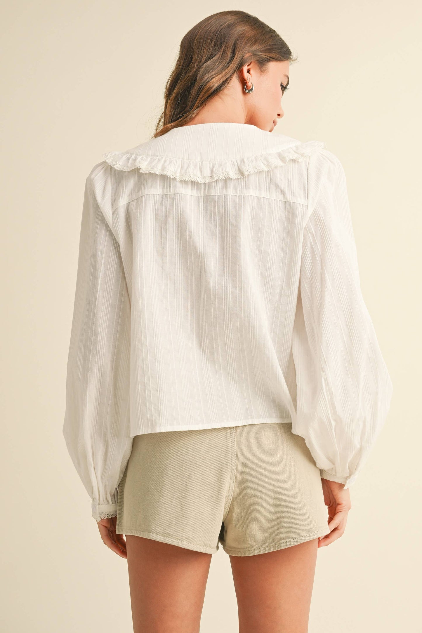TEXTURED FABRIC WITH TIE IN THE FRONT BLOUSE