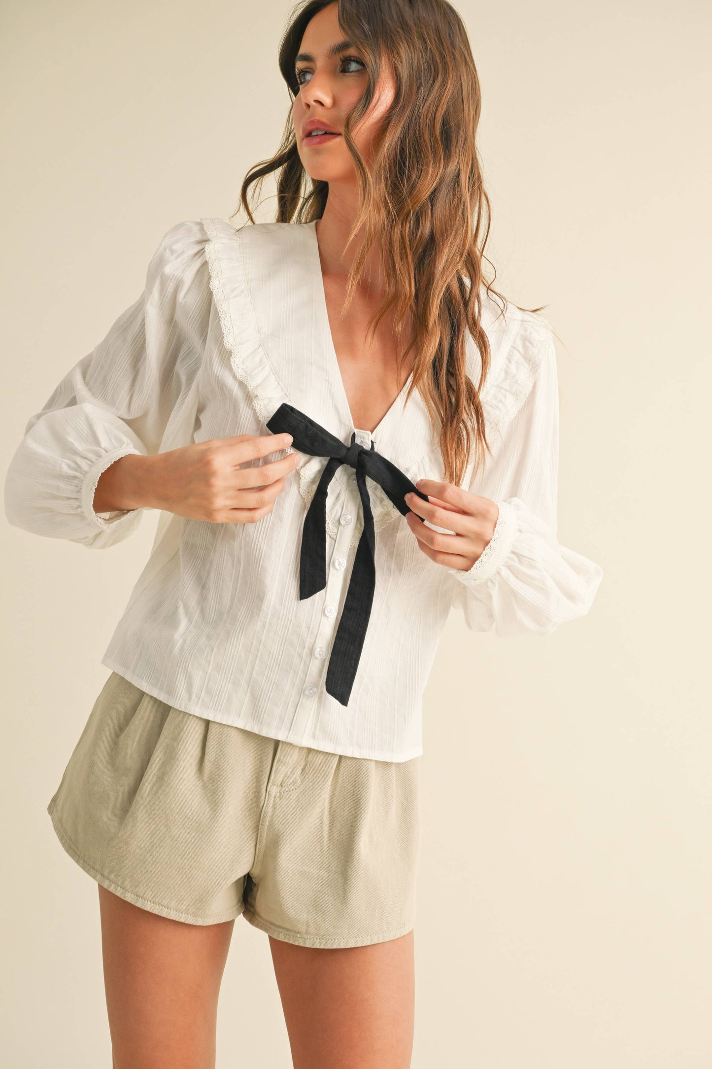 TEXTURED FABRIC WITH TIE IN THE FRONT BLOUSE