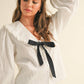 TEXTURED FABRIC WITH TIE IN THE FRONT BLOUSE