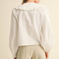 TEXTURED FABRIC WITH TIE IN THE FRONT BLOUSE