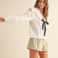 TEXTURED FABRIC WITH TIE IN THE FRONT BLOUSE